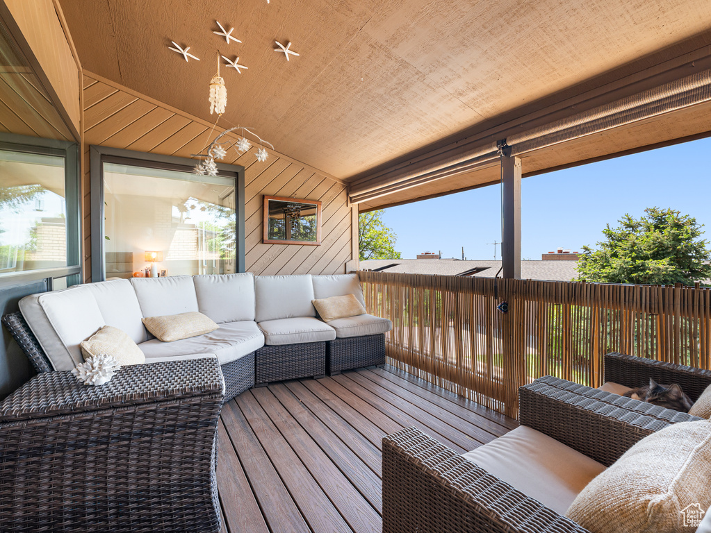 Wooden terrace with an outdoor living space