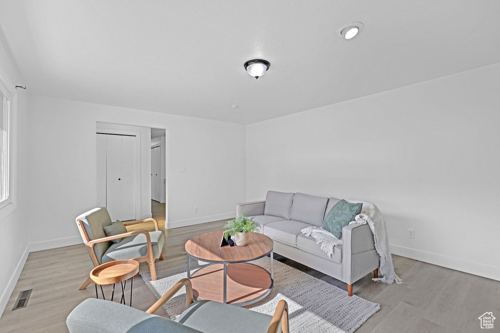 Living room featuring wood finished floors and baseboards