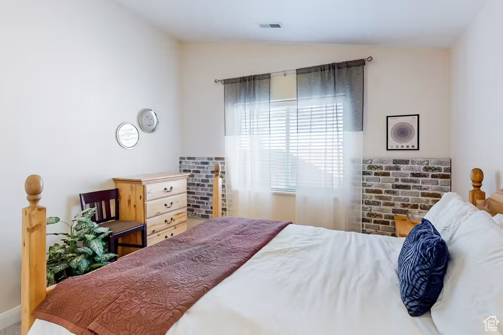 Bedroom featuring lofted ceiling