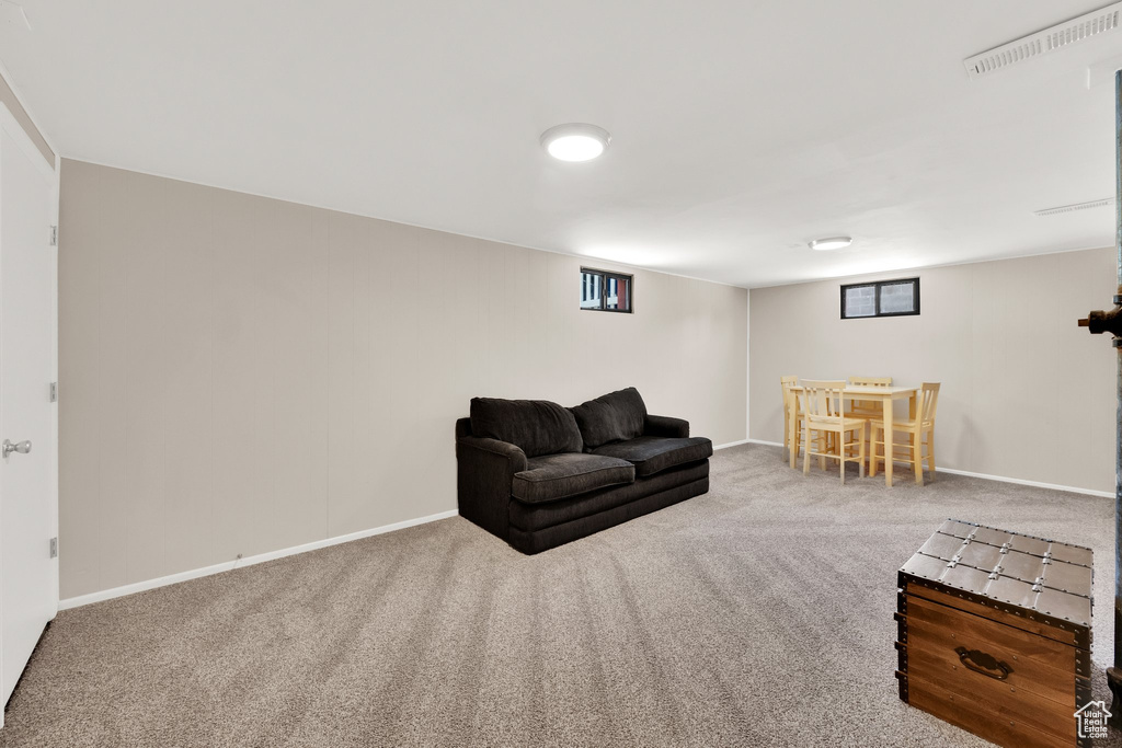 Living area with carpet flooring and baseboards