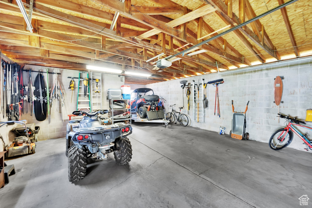 Garage with a garage door opener and concrete block wall