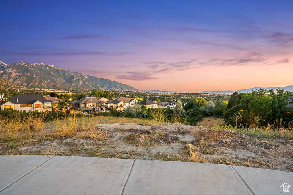 View of mountain backdrop featuring nearby suburban area