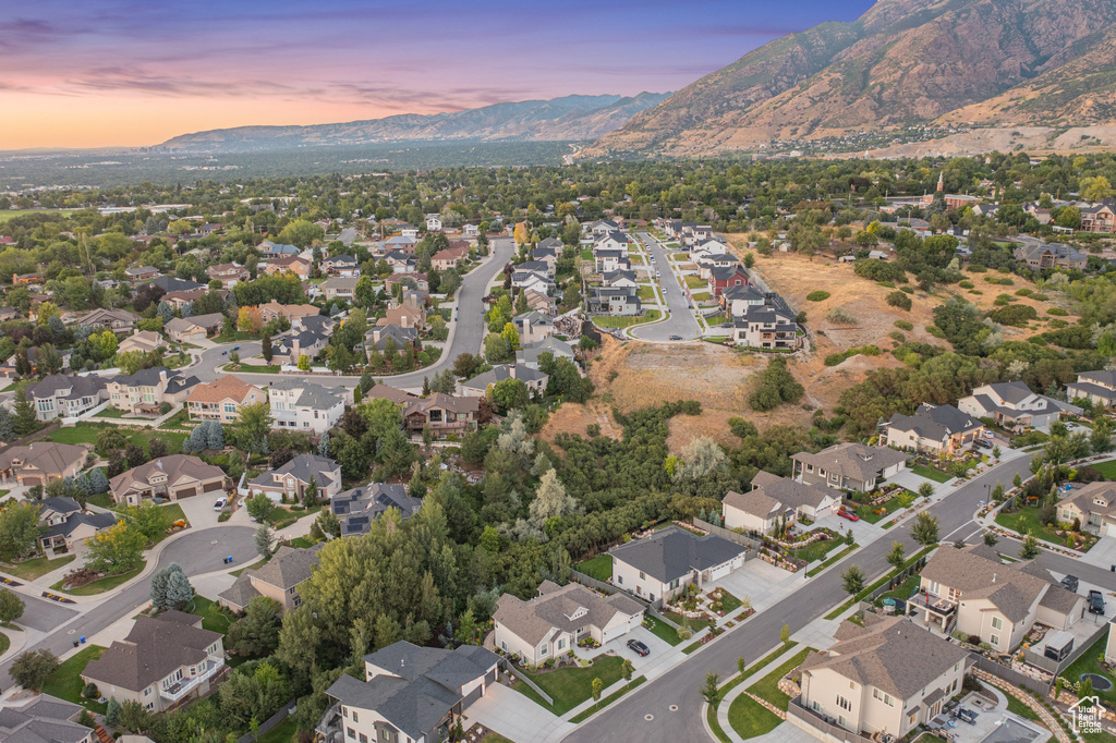 Aerial overview of property's location with mountains and nearby suburban area