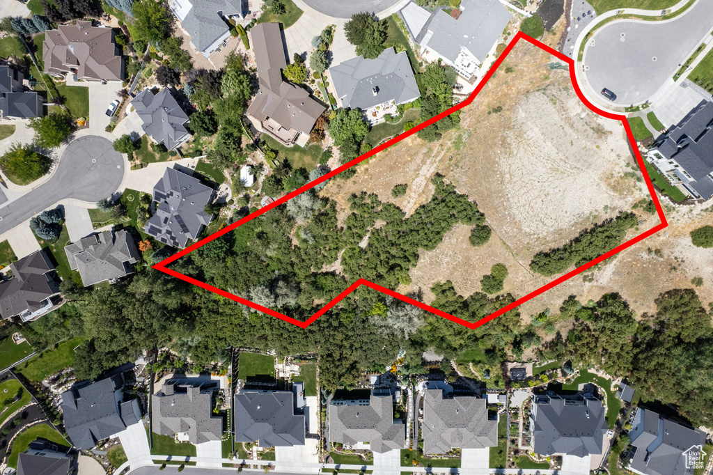 Aerial perspective of suburban area featuring property parcel outlined