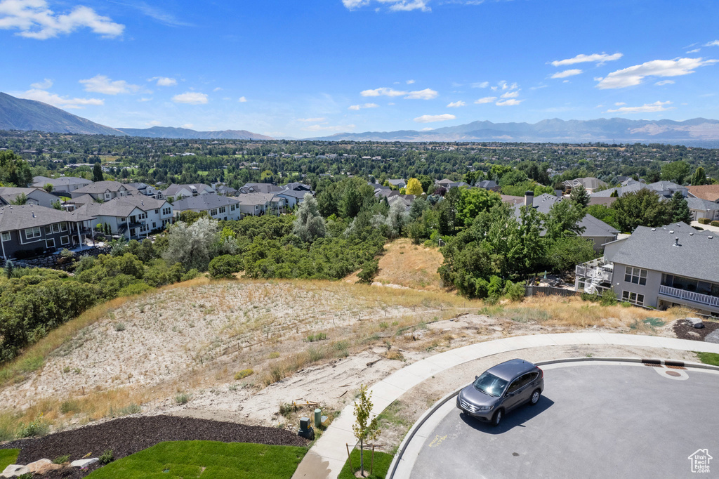 Aerial view of residential area featuring a mountainous background
