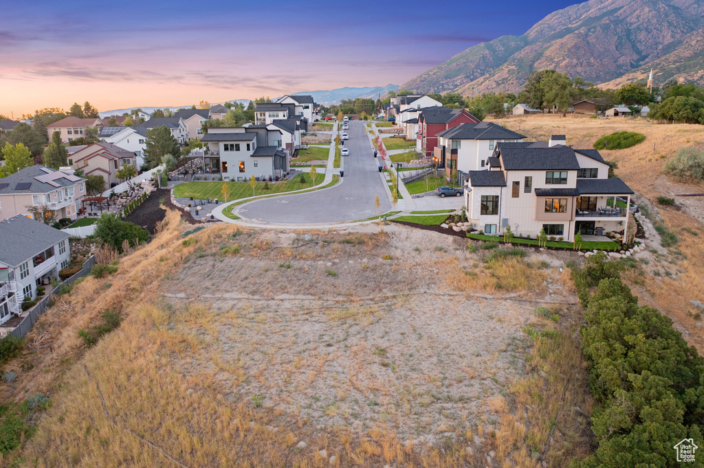 Aerial perspective of suburban area with a mountain backdrop