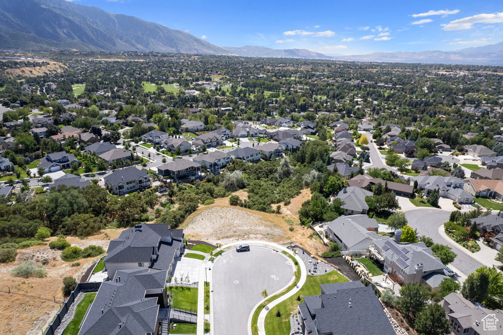 Aerial perspective of suburban area with a mountain backdrop