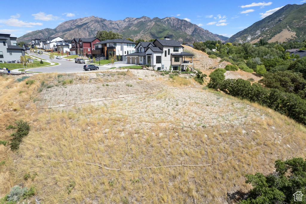 View of mountain backdrop featuring nearby suburban area