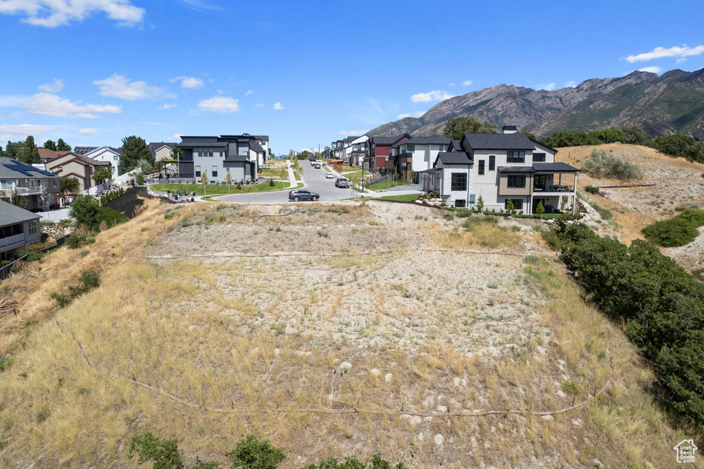 View of street with a residential view and a mountain view