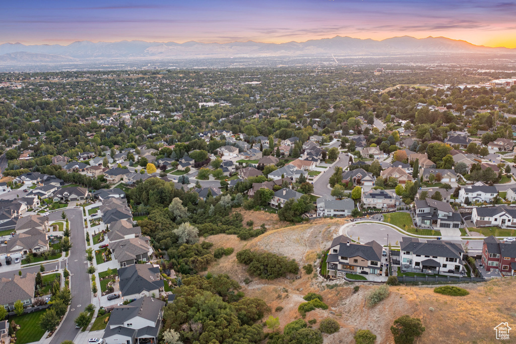 View of property location featuring a mountain backdrop and nearby suburban area
