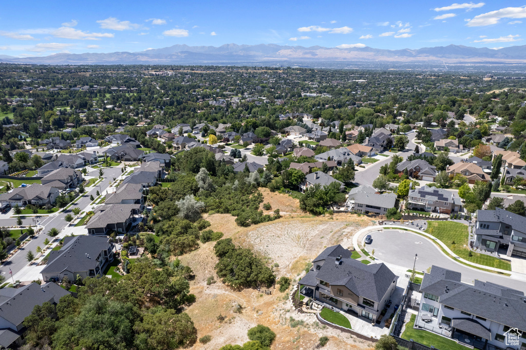 Aerial perspective of suburban area featuring a mountainous background