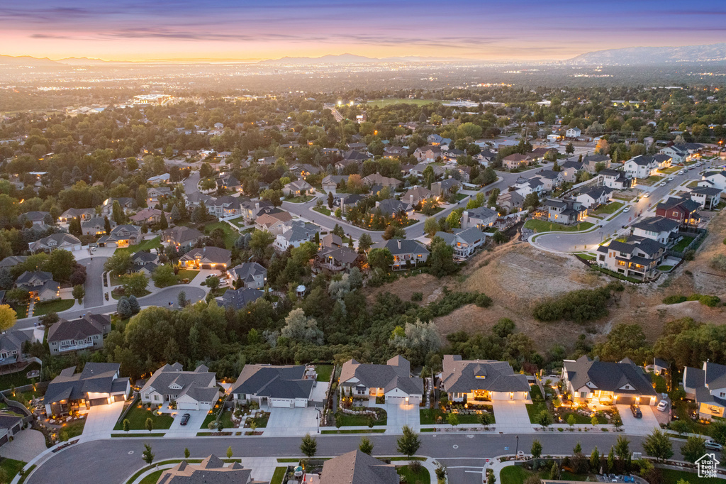 Aerial view at dusk of a residential view and a mountain view