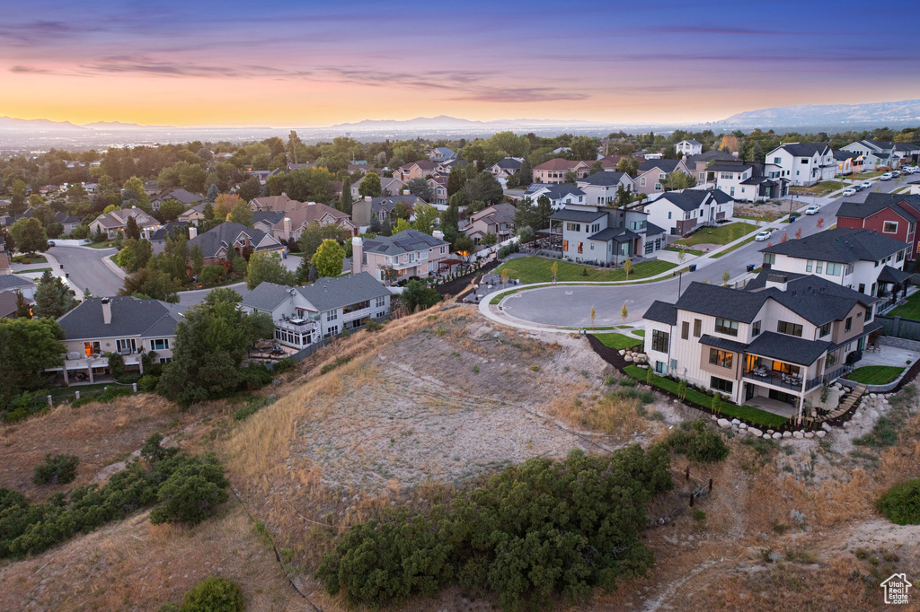 Aerial view of residential area featuring a mountainous background
