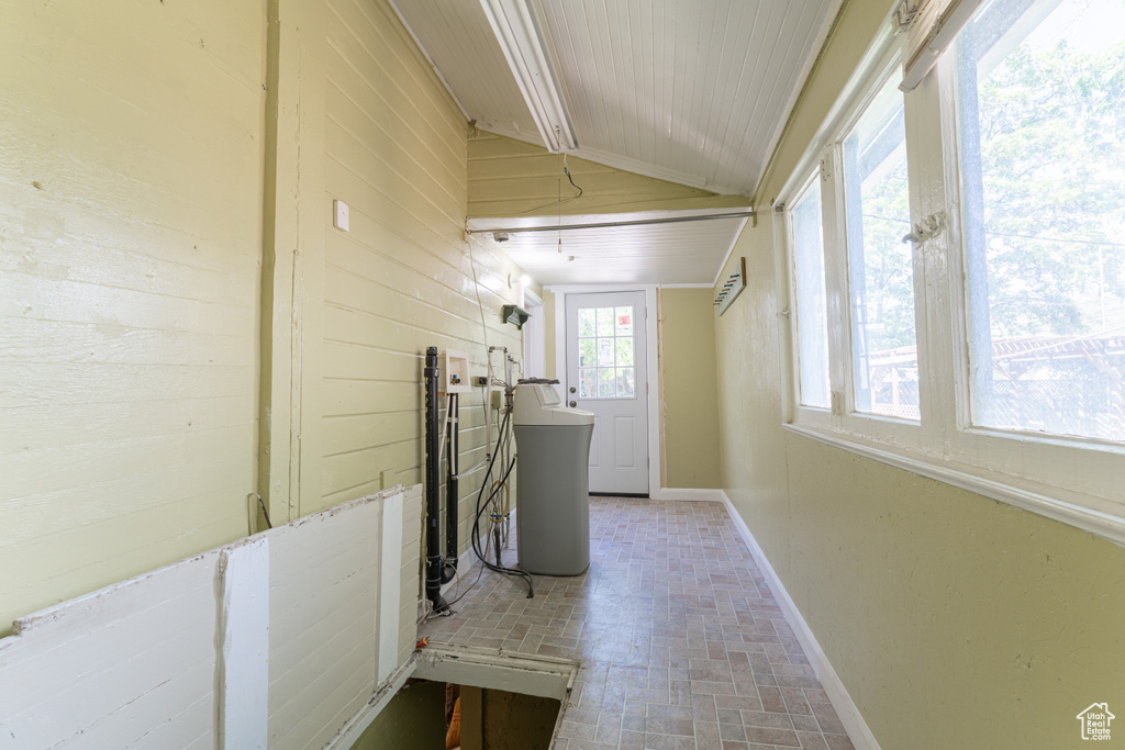 Laundry room featuring brick patterned flooring