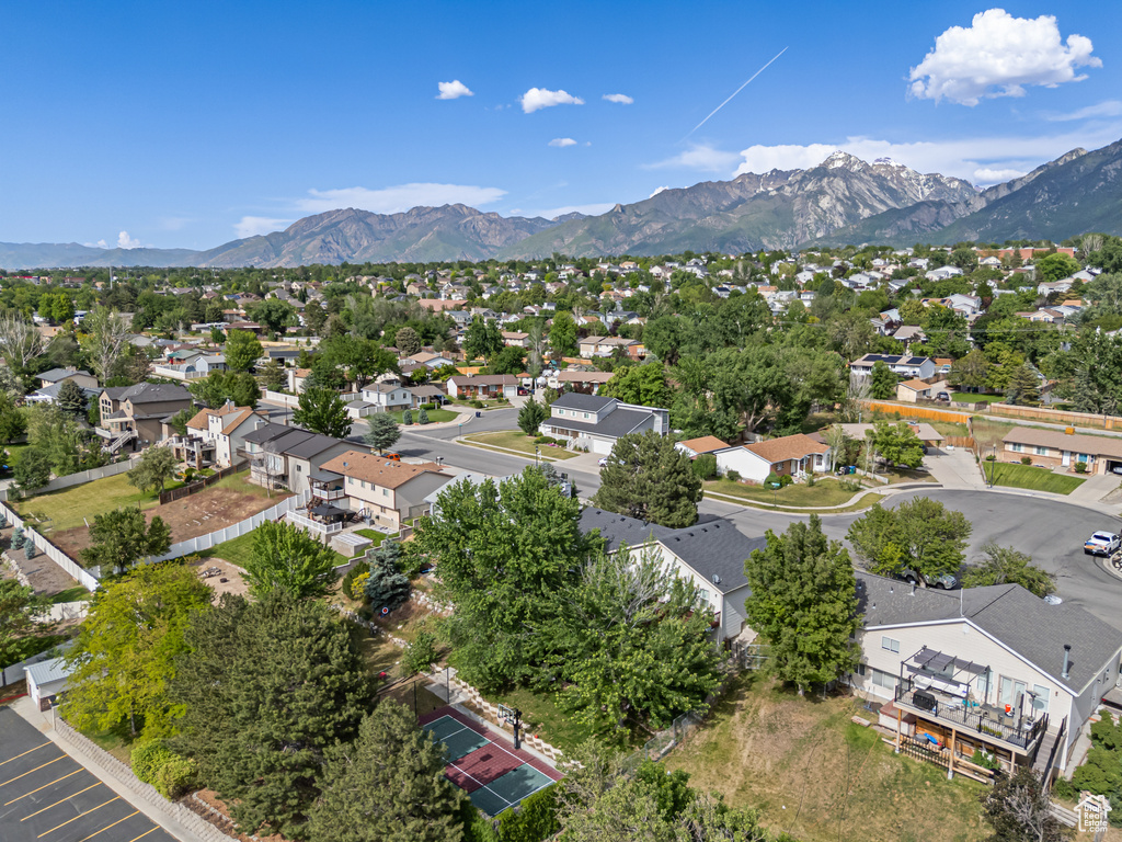 Aerial perspective of suburban area with a mountain backdrop
