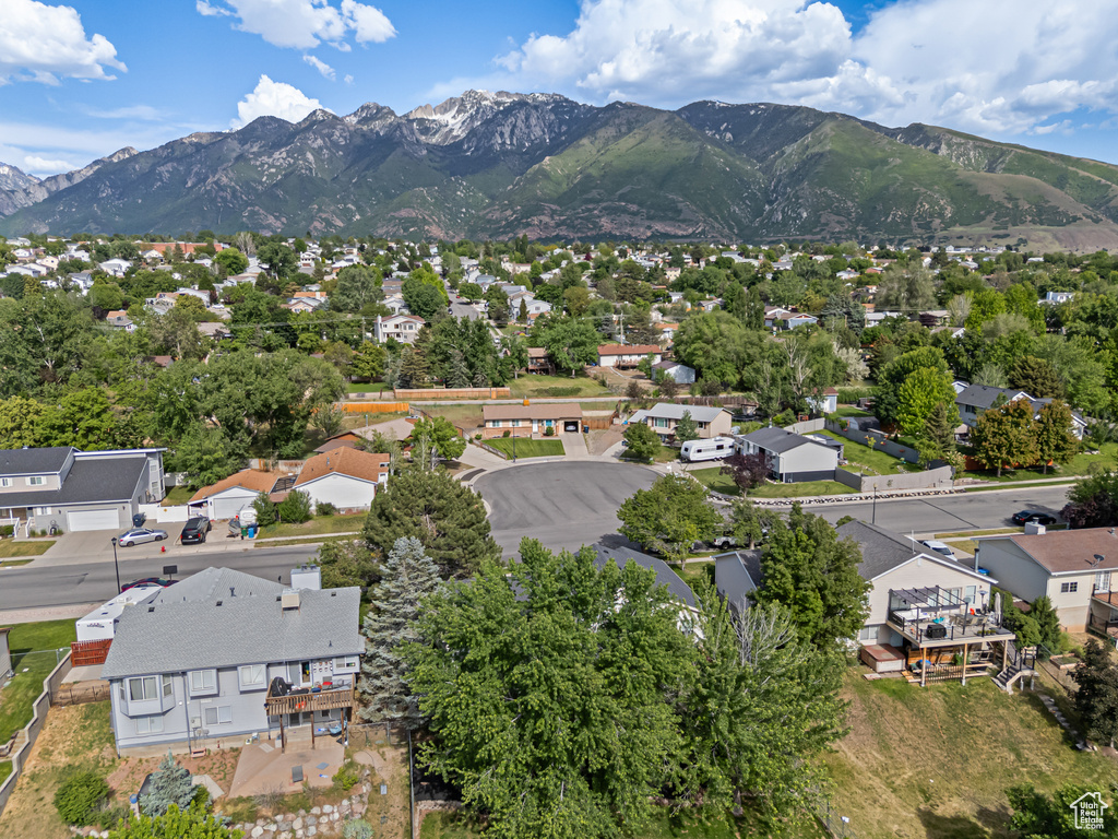Aerial perspective of suburban area featuring a mountainous background