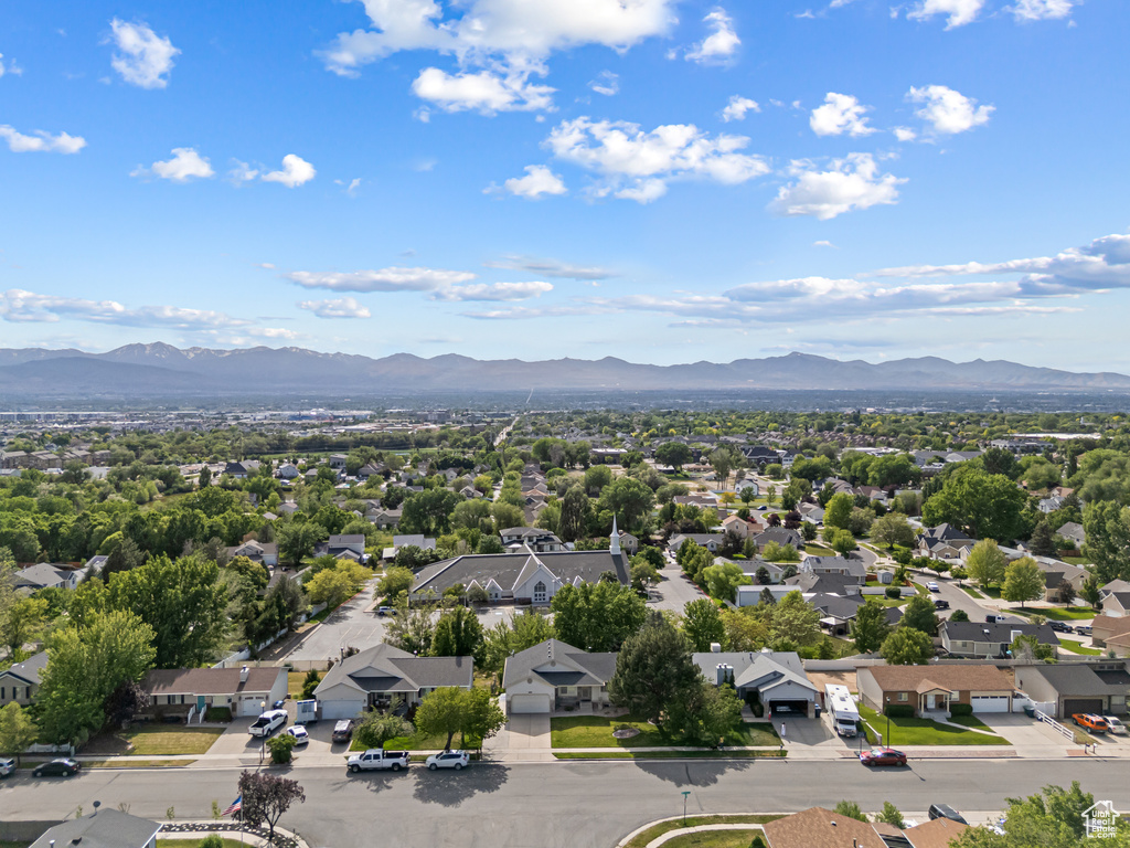 Aerial perspective of suburban area featuring a mountain backdrop