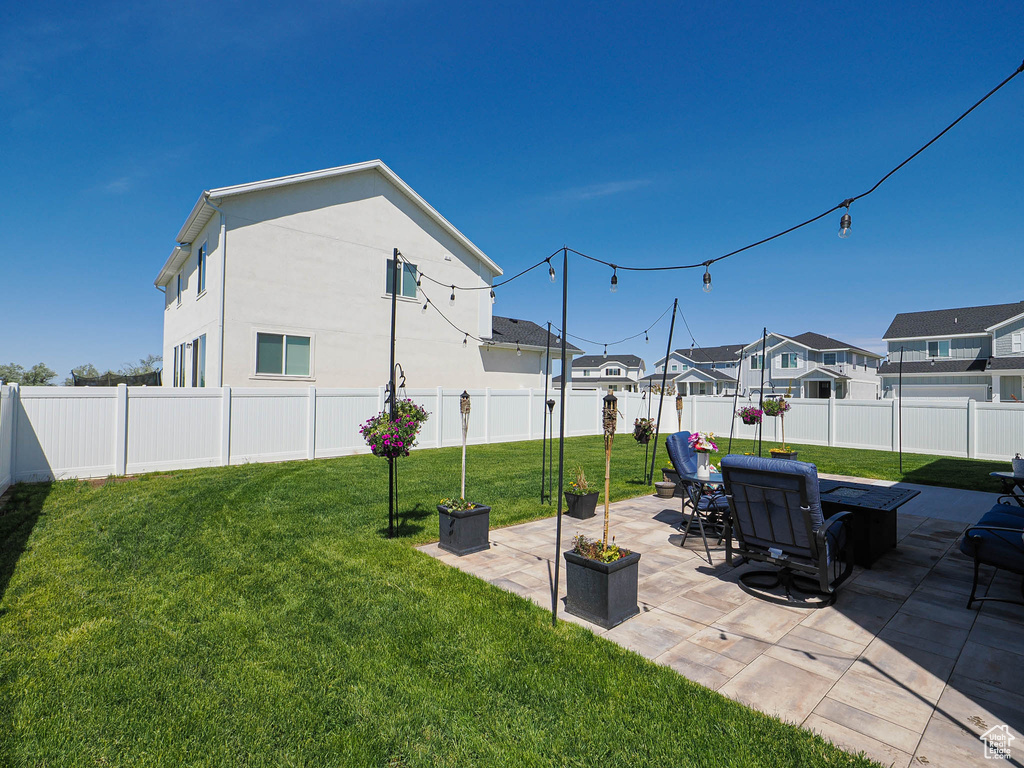 View of yard featuring a patio and a residential view
