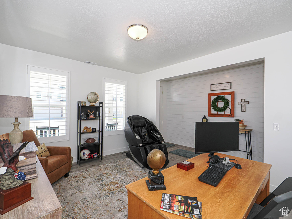 Office area featuring wood finished floors and baseboards