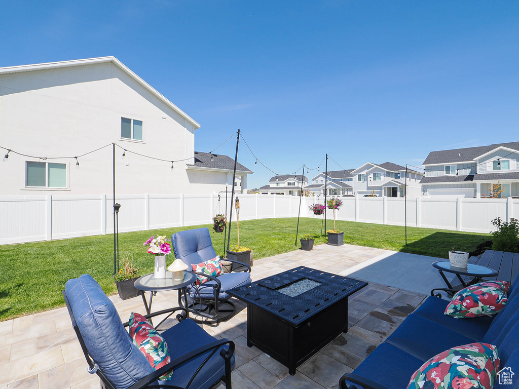 View of patio / terrace featuring a residential view and an outdoor fire pit