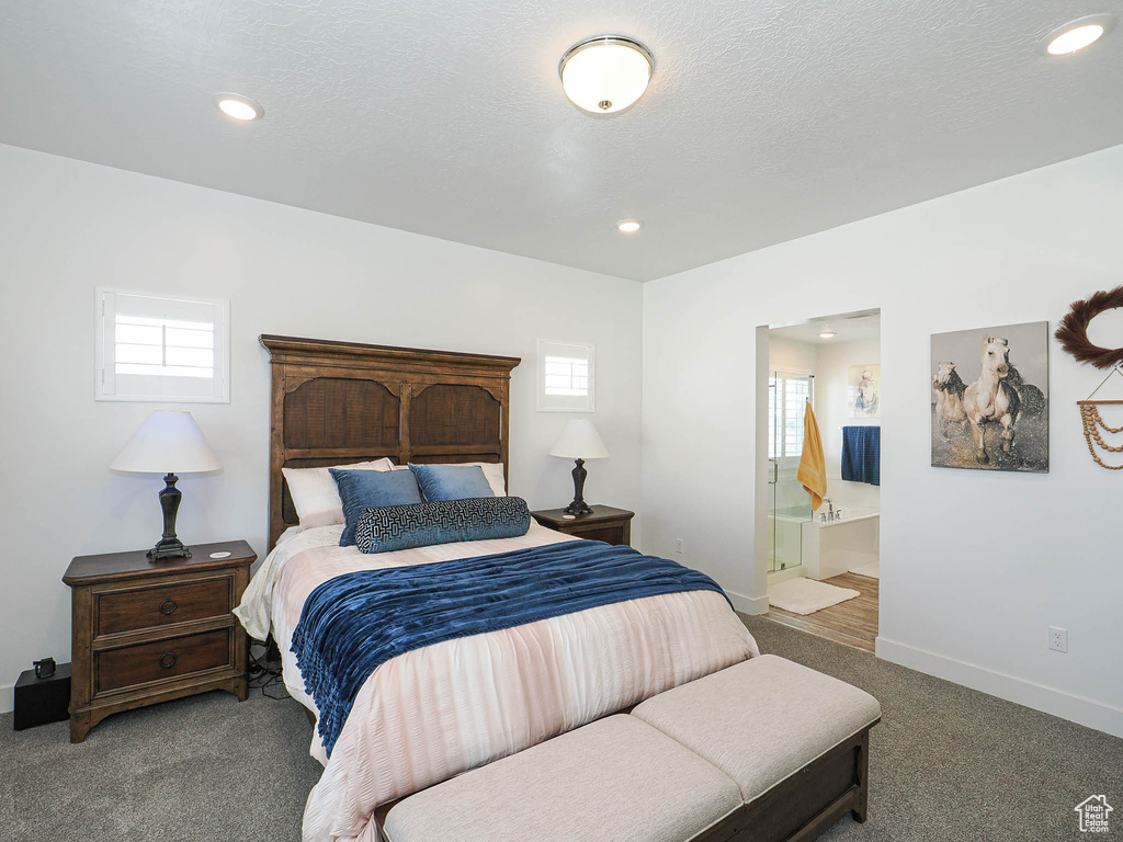 Bedroom with carpet, recessed lighting, baseboards, and connected bathroom