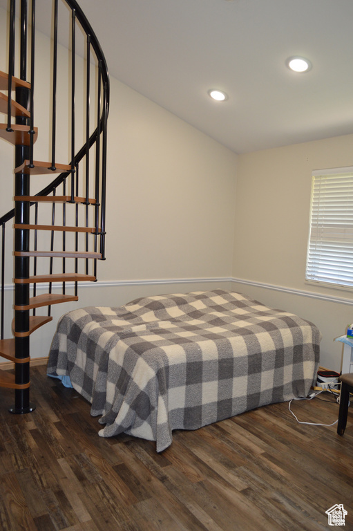 Bedroom featuring dark wood-type flooring, recessed lighting, and baseboards