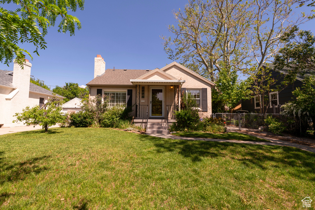 View of front of property with a chimney