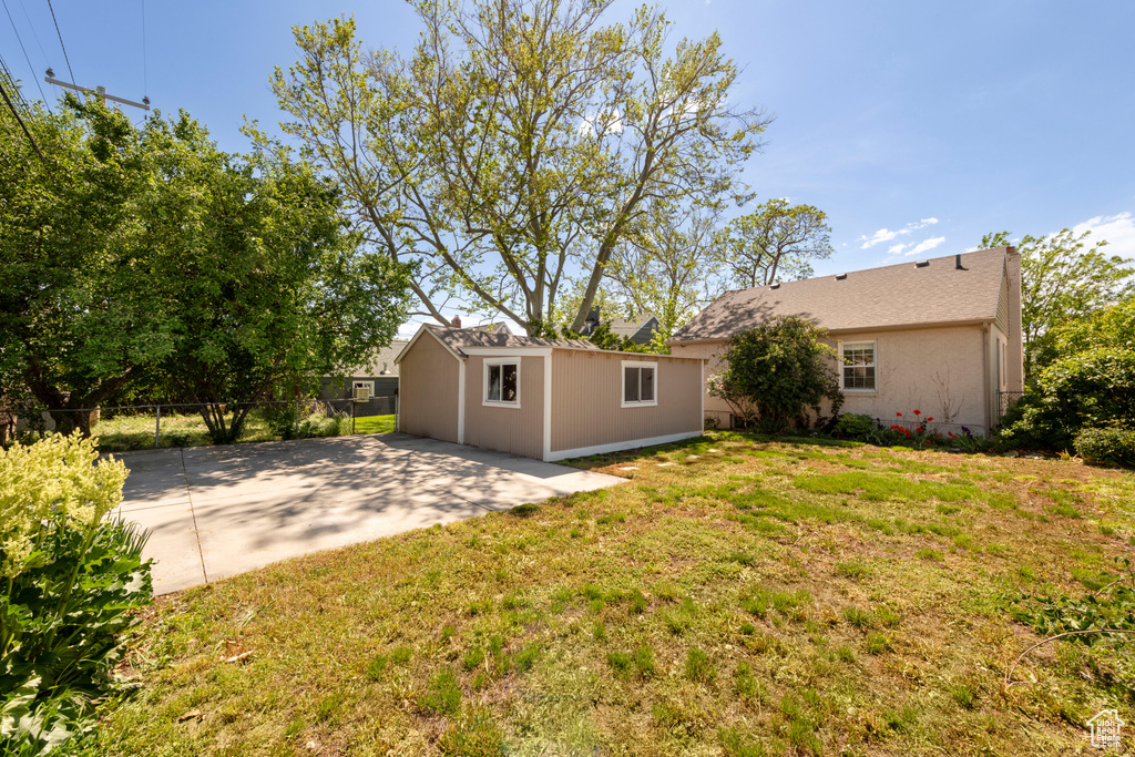 View of yard with an outbuilding and a patio area