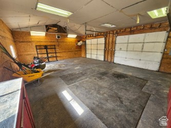 Garage featuring wood walls
