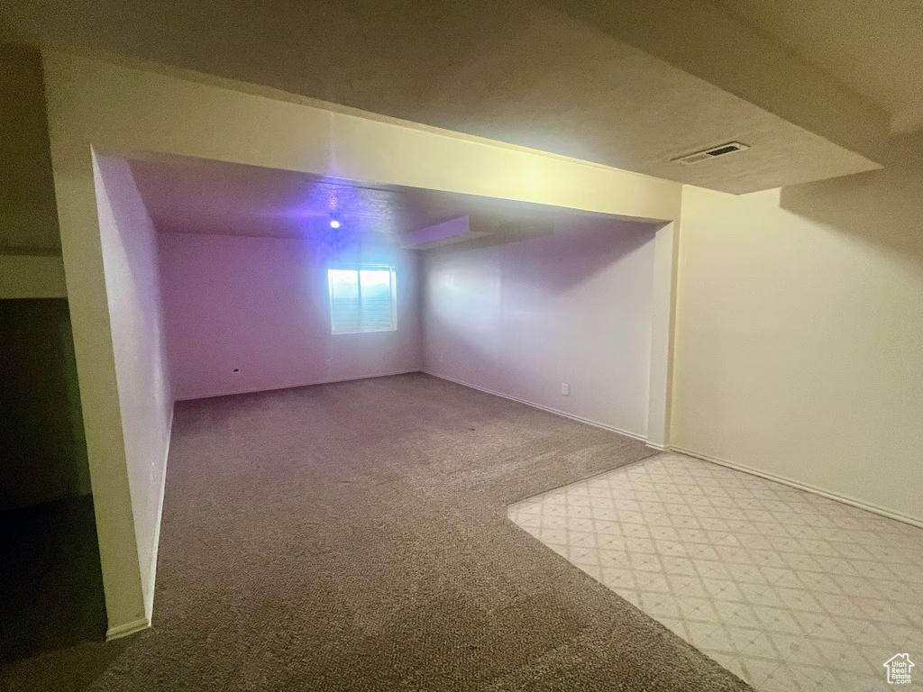 Basement with carpet