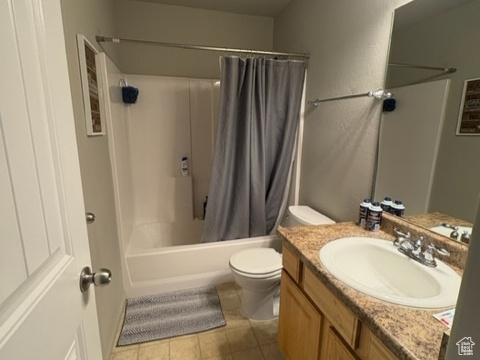 Full bath featuring vanity and shower / bathtub combination with curtain