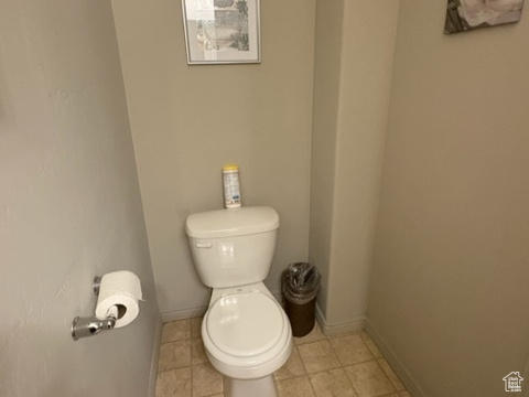 Bathroom featuring toilet and baseboards