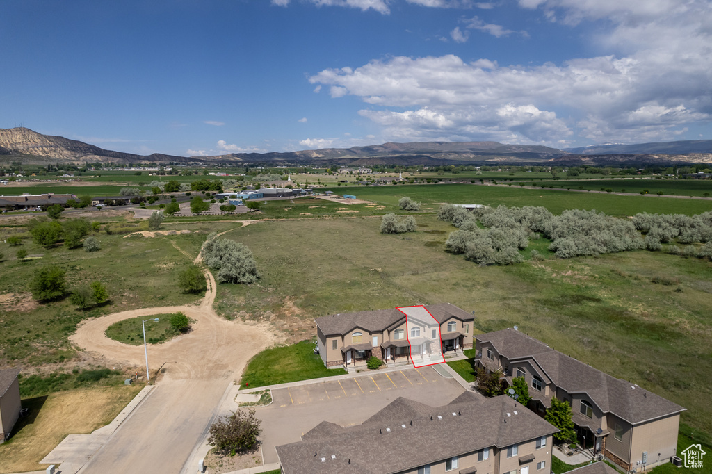 Aerial view of sparsely populated area with a mountainous background