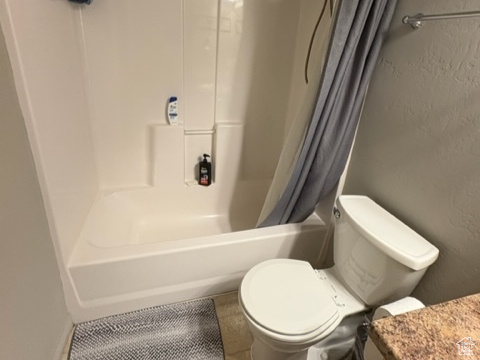 Bathroom with vanity and shower / tub combo