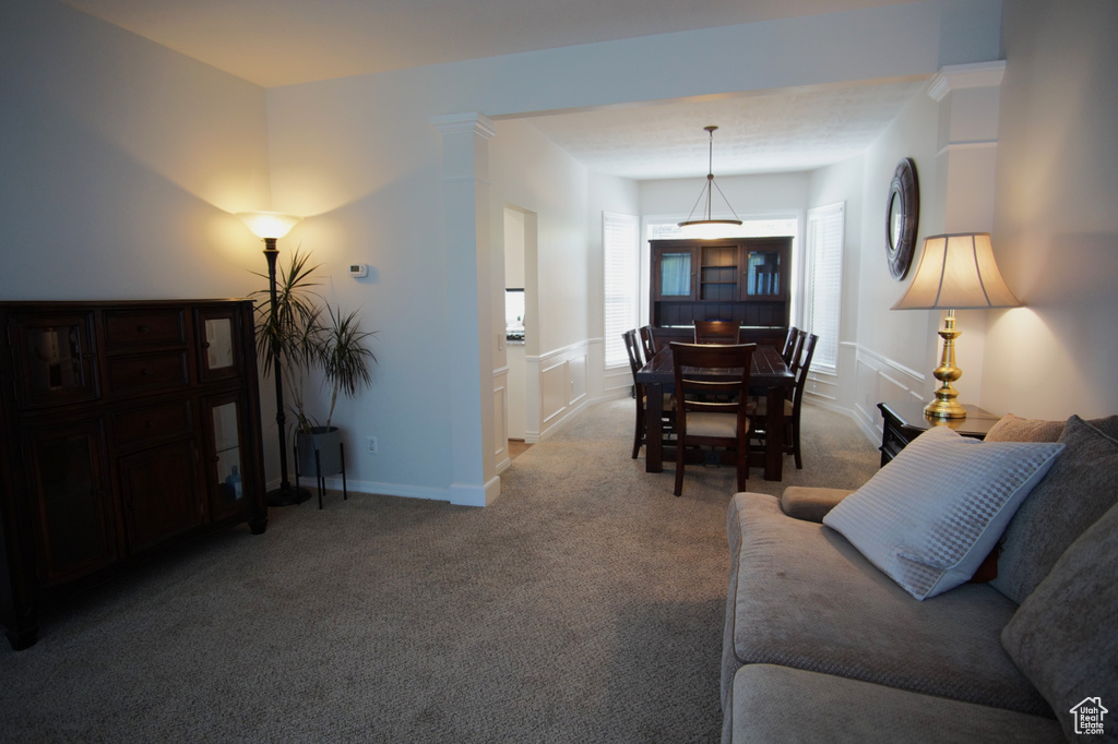 Living area with carpet floors and baseboards