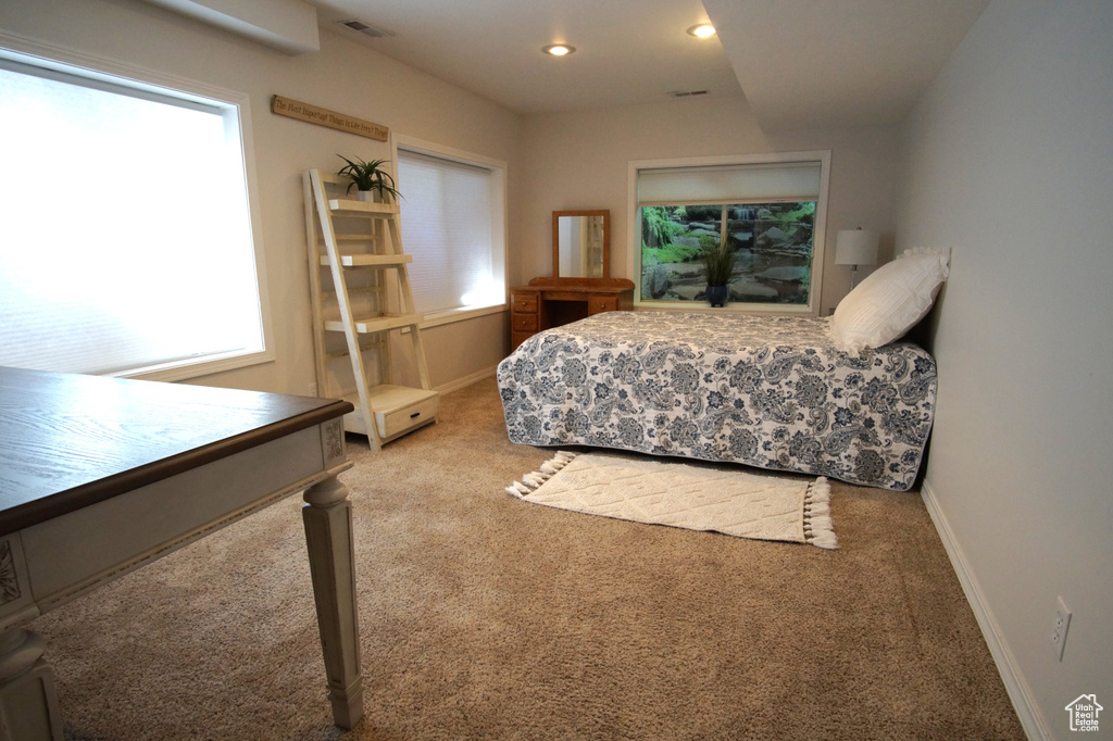 Bedroom featuring carpet flooring, baseboards, and recessed lighting