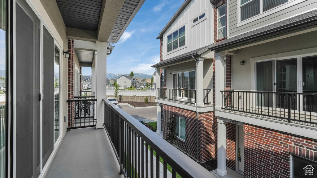 Balcony with a mountain view and a residential view