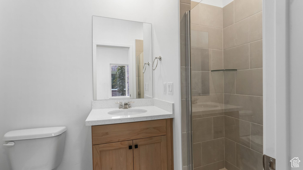 Full bath with vanity and a stall shower