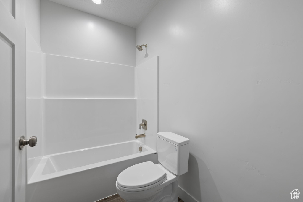 Bathroom with toilet and shower / bathtub combination