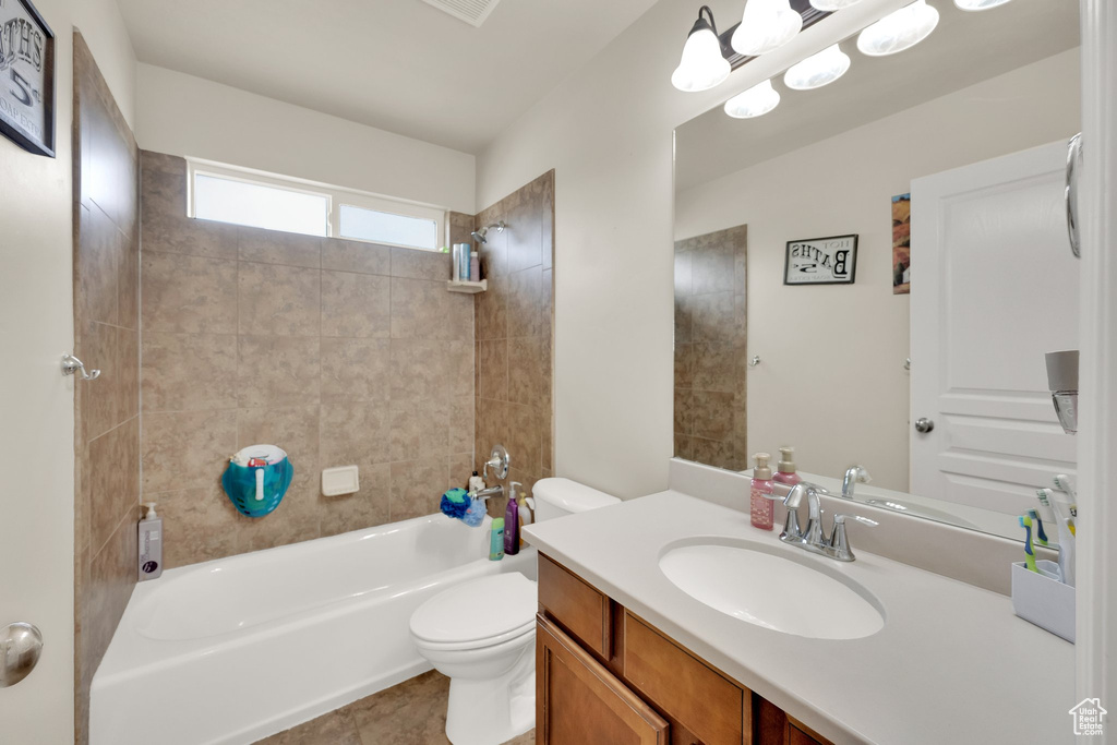 Full bath with vanity, toilet, and shower / tub combination