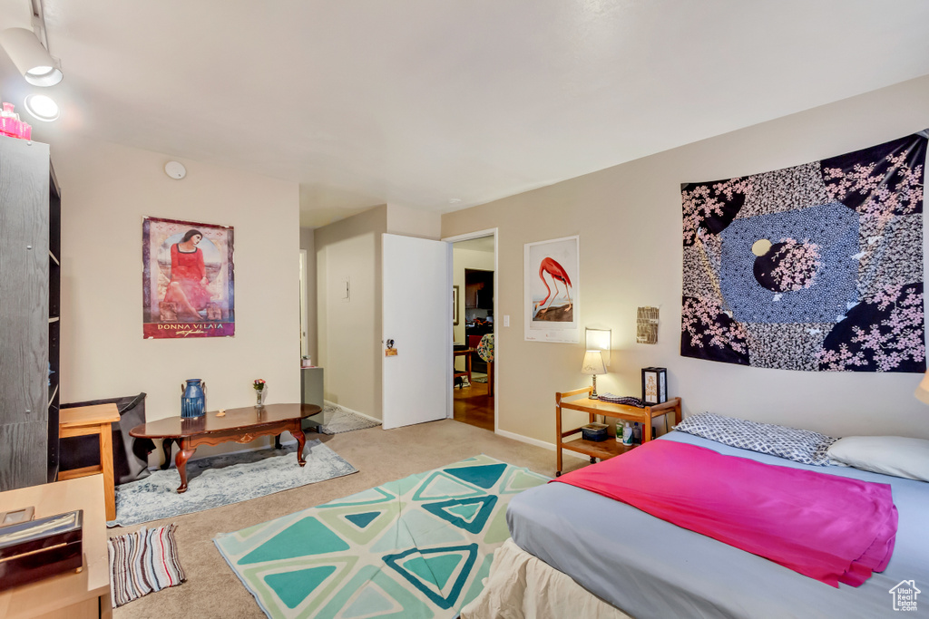 Bedroom with carpet and baseboards