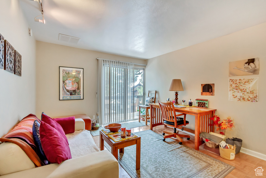 Office area featuring wood finished floors and baseboards