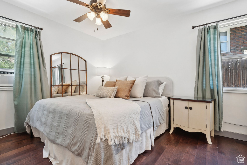 Bedroom with dark wood finished floors and ceiling fan