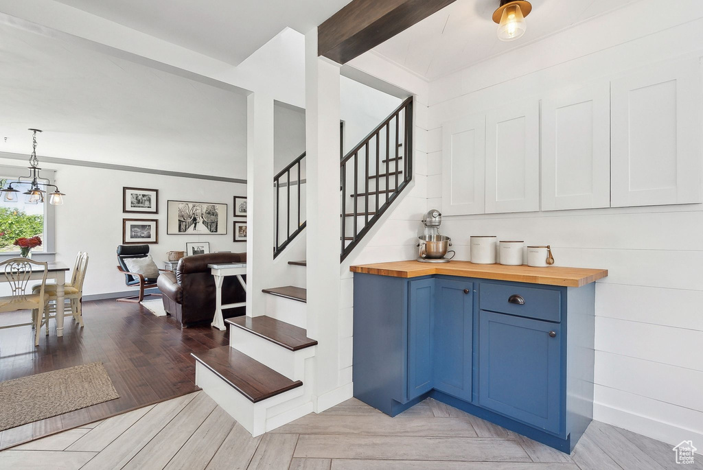 Staircase featuring wood finished floors
