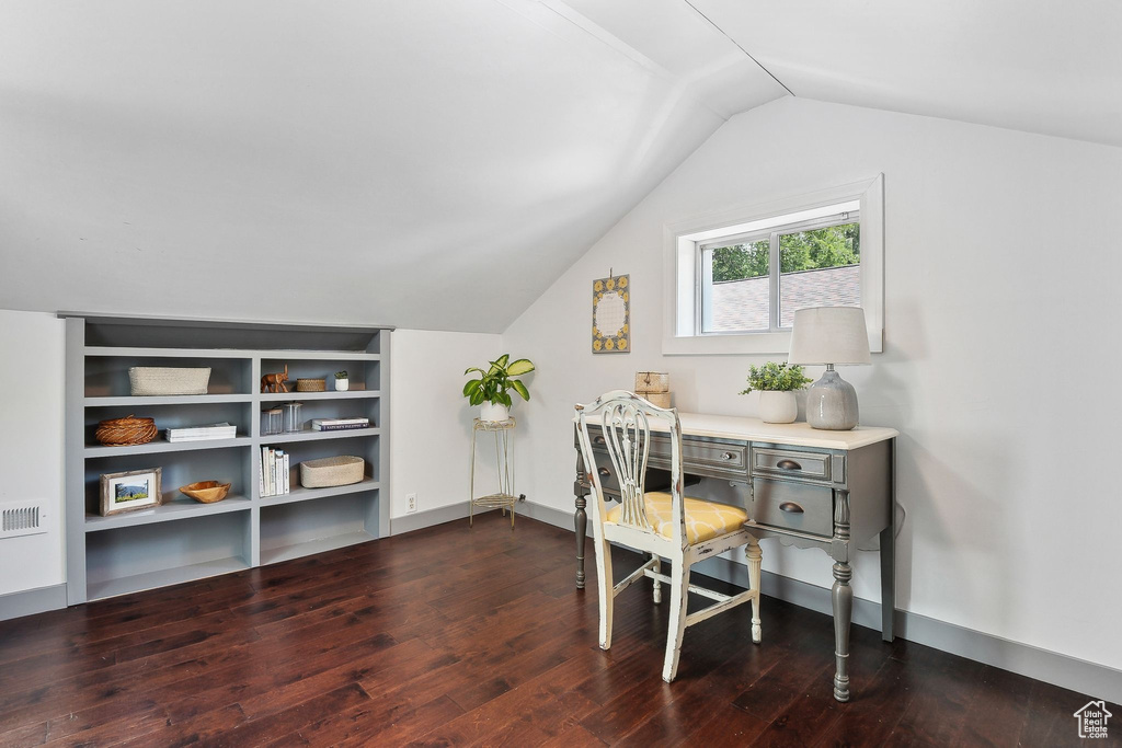 Office area with wood finished floors and lofted ceiling