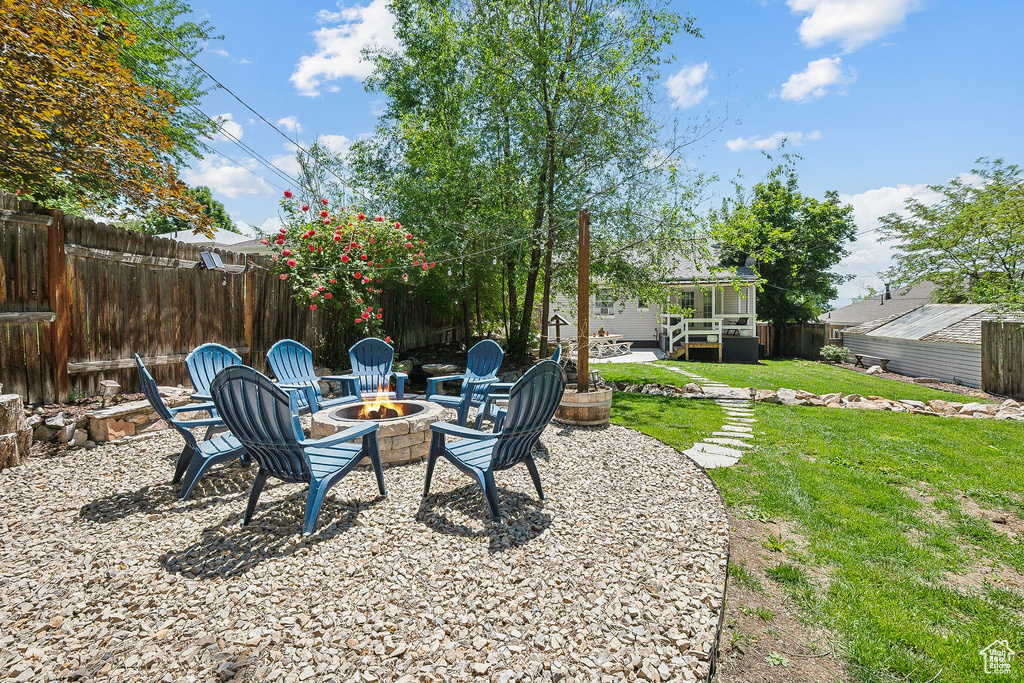 View of yard with a fire pit
