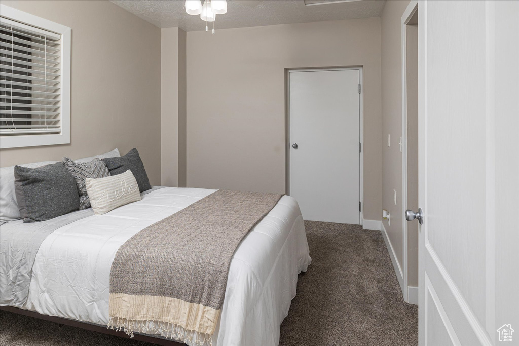 Carpeted bedroom with baseboards