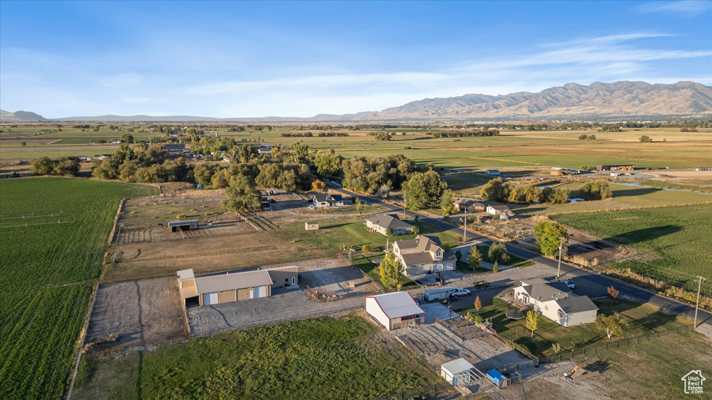 Aerial view of property\'s location with a mountain backdrop and rural landscape
