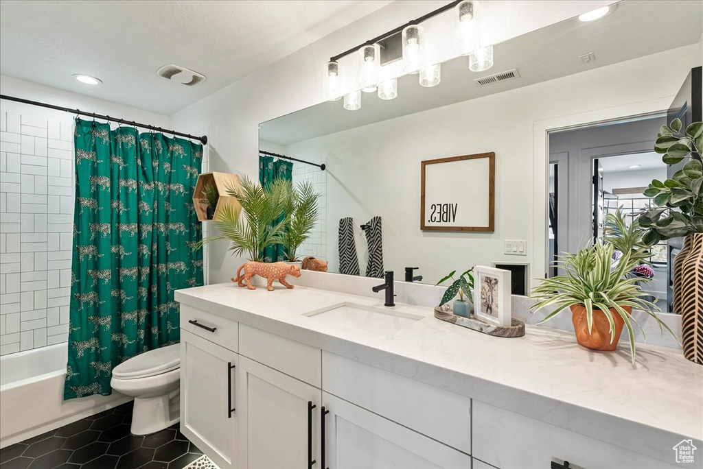 Bathroom with vanity, toilet, tile patterned flooring, shower / bath combination with curtain, and recessed lighting