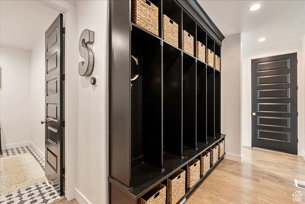 Mudroom with baseboards, recessed lighting, and light wood finished floors